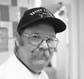 Mike searing a hat that says Native Viet Nam Vet